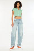 low rise jeans with a horseshoe on the pocket